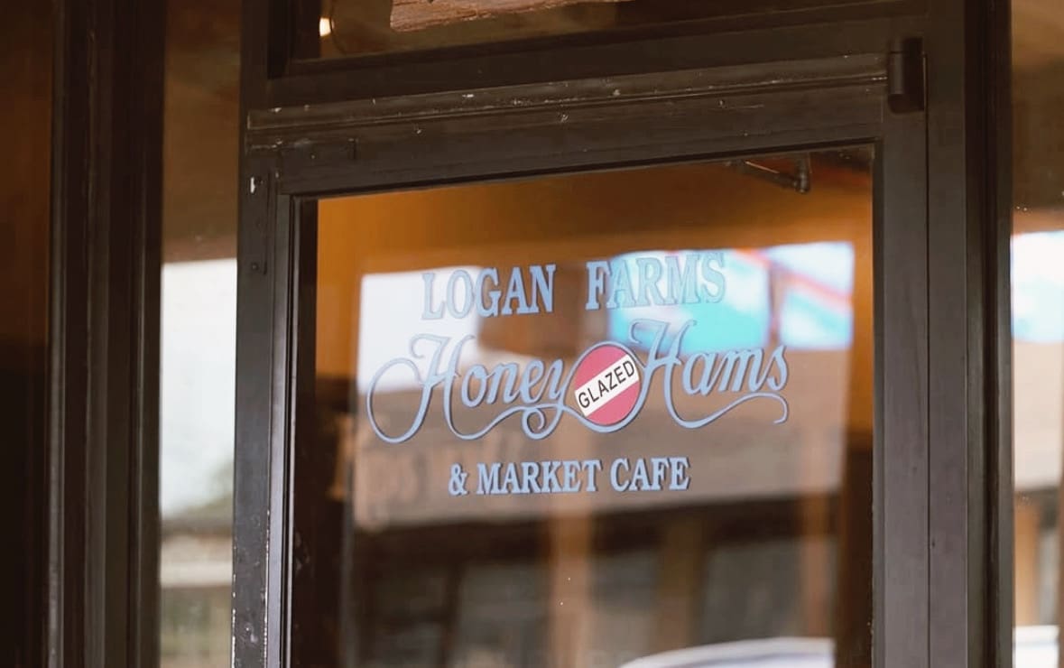 logan farms sign on exterior door